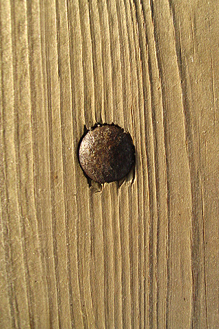 Nail in Wood iPhone Wallpaper